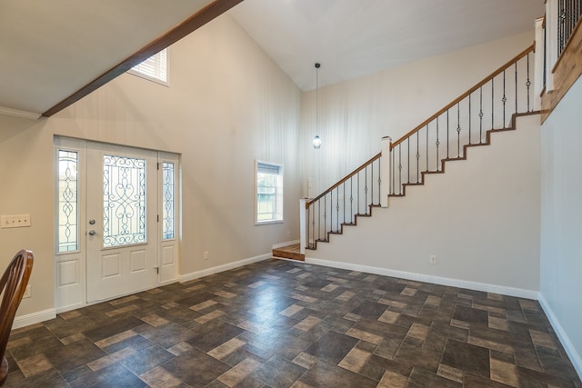 foyer entrance with high vaulted ceiling