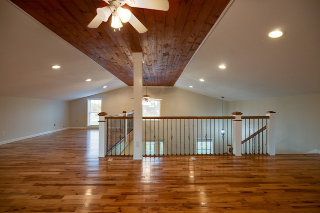 empty room featuring wooden ceiling, lofted ceiling, ceiling fan, and hardwood / wood-style flooring