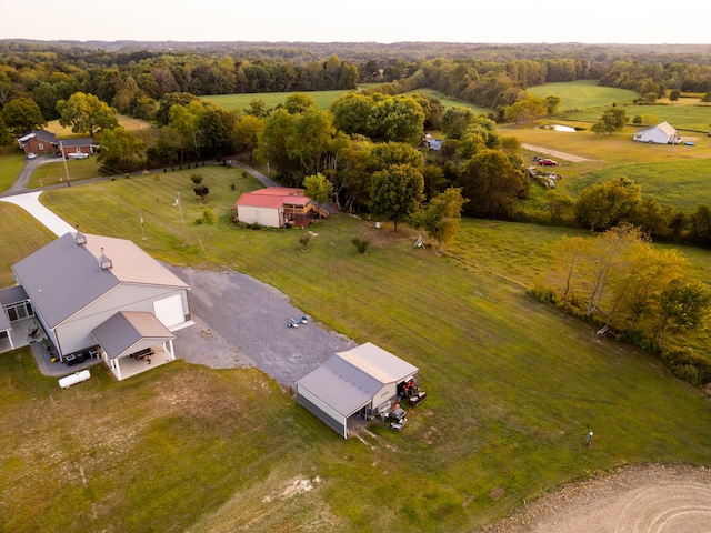 birds eye view of property with a rural view