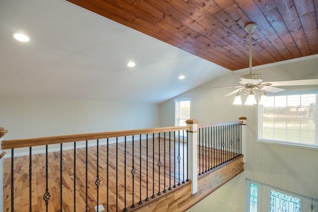 hall with wood-type flooring, wood ceiling, and vaulted ceiling