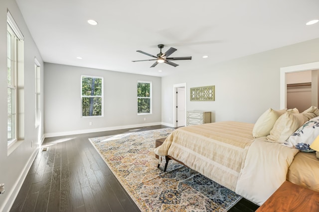 bedroom featuring ceiling fan and dark wood-type flooring