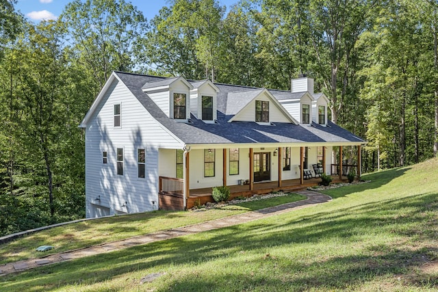 new england style home with a front lawn and a porch