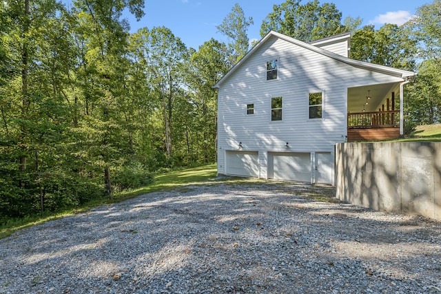 view of side of home featuring a garage