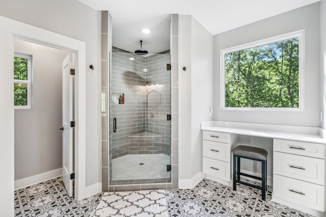 bathroom featuring tile patterned floors and a shower with shower door