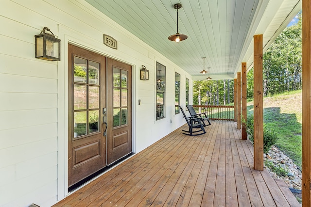 wooden terrace with a porch