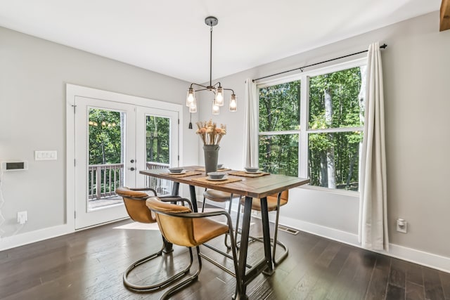 dining room with french doors and dark wood-type flooring