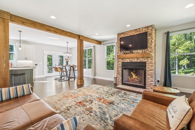 living room featuring dark hardwood / wood-style floors and a fireplace