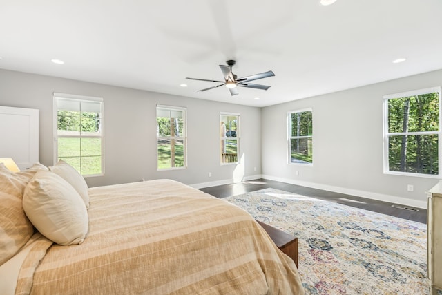 bedroom with ceiling fan and hardwood / wood-style floors