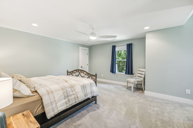 bedroom with light carpet and ceiling fan