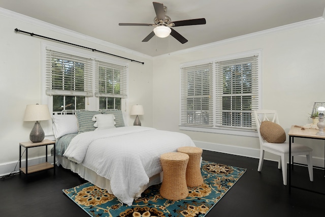 bedroom featuring dark hardwood / wood-style flooring, ornamental molding, and ceiling fan