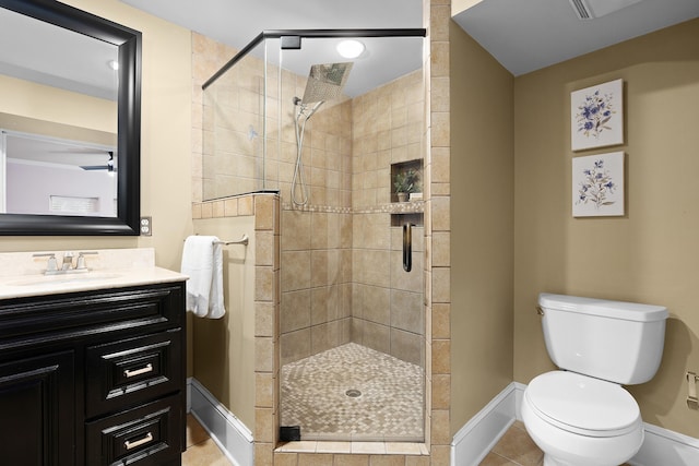 bathroom with a shower with door, toilet, tile patterned flooring, and vanity