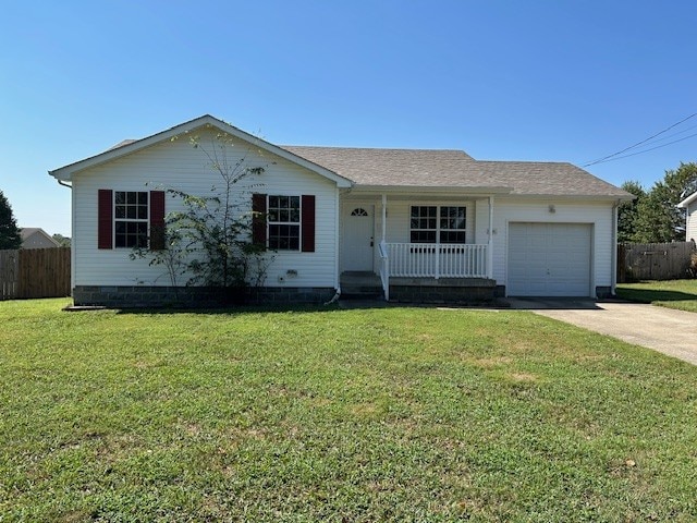 ranch-style home with a front yard, a porch, and a garage