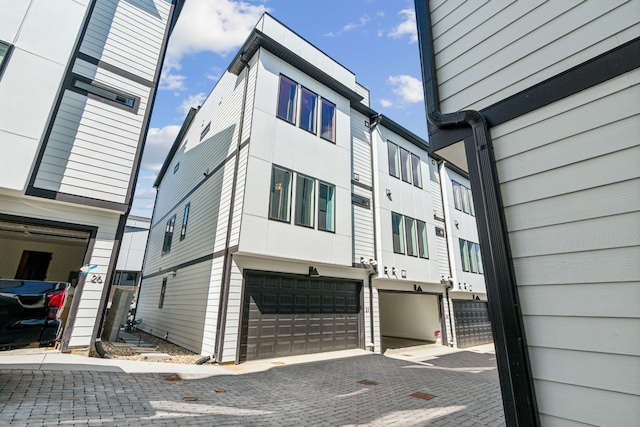 view of side of home featuring a garage