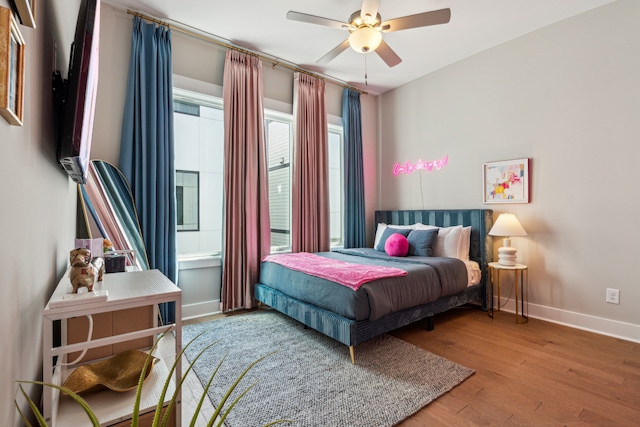 bedroom featuring hardwood / wood-style floors and ceiling fan