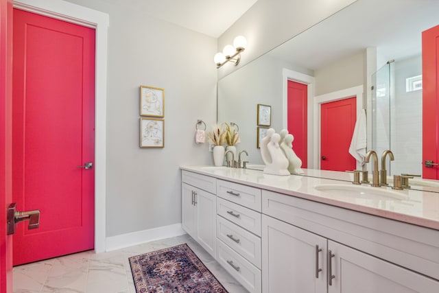 bathroom featuring a shower with shower door and vanity