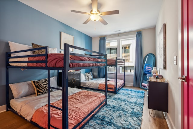 bedroom featuring wood-type flooring and ceiling fan