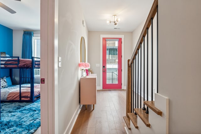 foyer entrance featuring ceiling fan and light hardwood / wood-style flooring