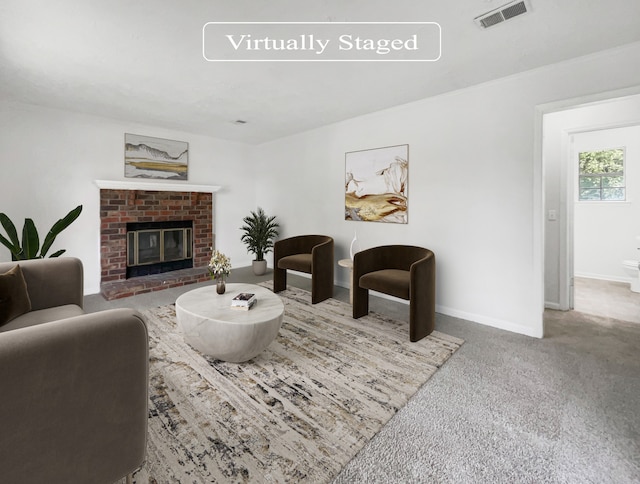 carpeted living room featuring a brick fireplace