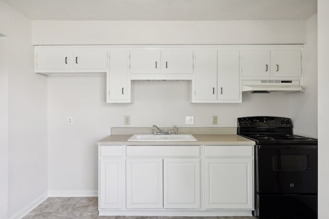 kitchen with black / electric stove, white cabinetry, and sink