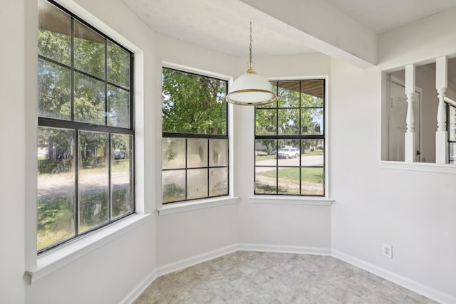 unfurnished dining area featuring a wealth of natural light