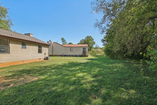 view of yard featuring central AC unit