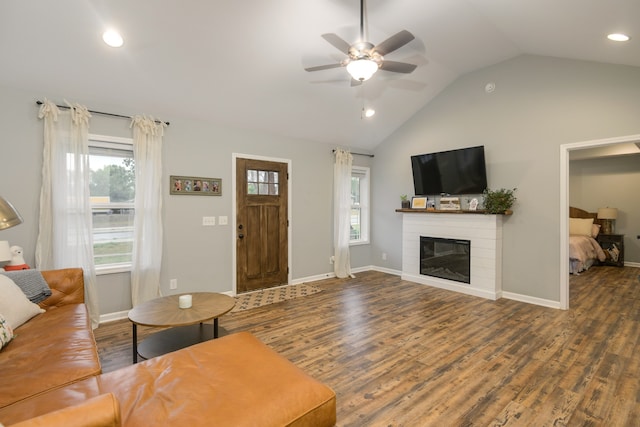 living room featuring ceiling fan, lofted ceiling, and dark hardwood / wood-style flooring