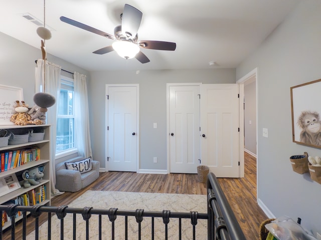 bedroom featuring wood-type flooring and ceiling fan