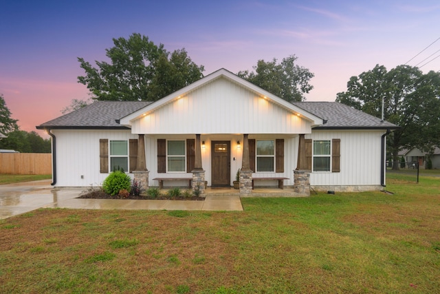 view of front of property with a yard