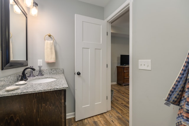 bathroom with vanity and hardwood / wood-style flooring