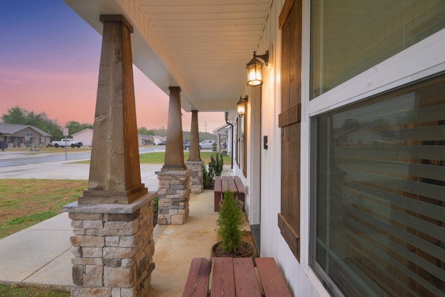 patio terrace at dusk with covered porch