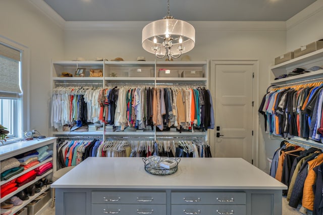 spacious closet featuring an inviting chandelier