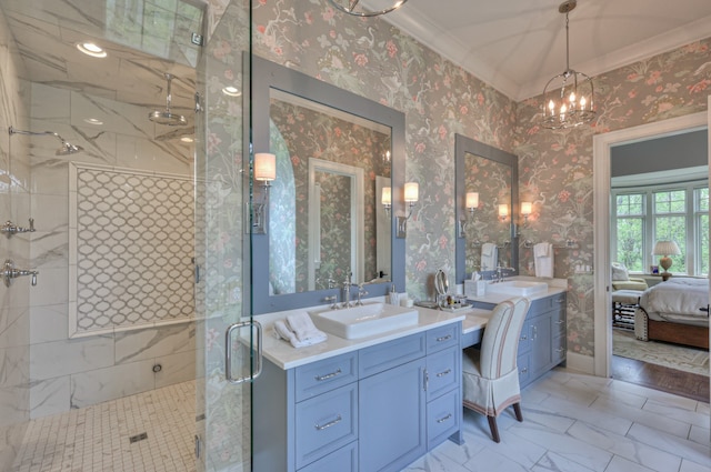 bathroom with a notable chandelier, vanity, ornamental molding, and a shower with door