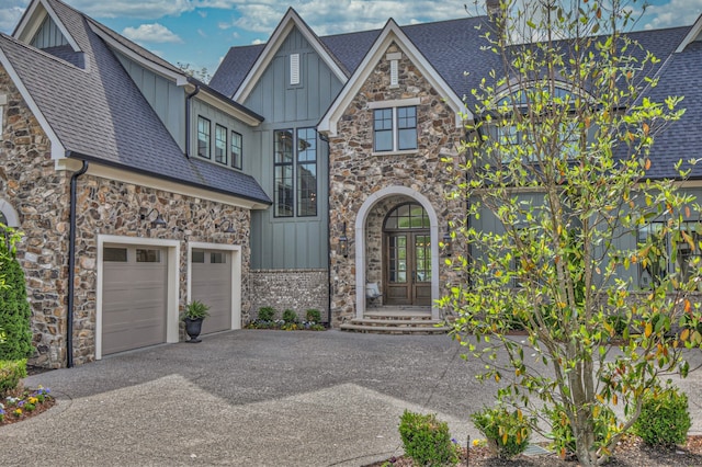 view of front of home featuring a garage and french doors