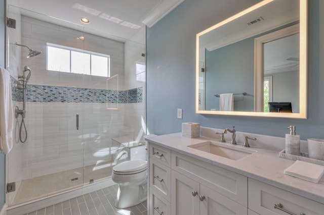 bathroom with tile patterned flooring, a shower with door, crown molding, vanity, and toilet