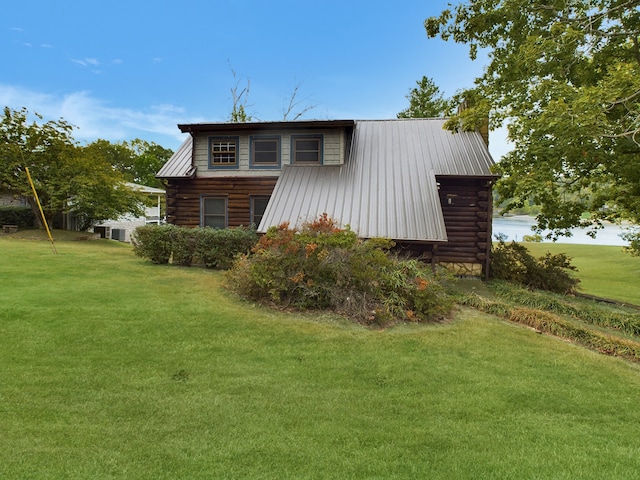 view of property exterior with a yard