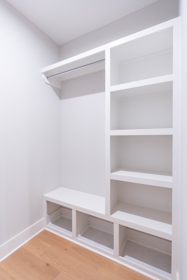 mudroom with wood-type flooring