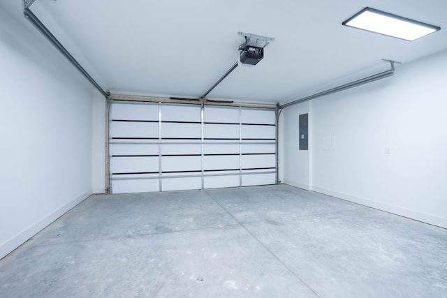 garage with a garage door opener and electric panel