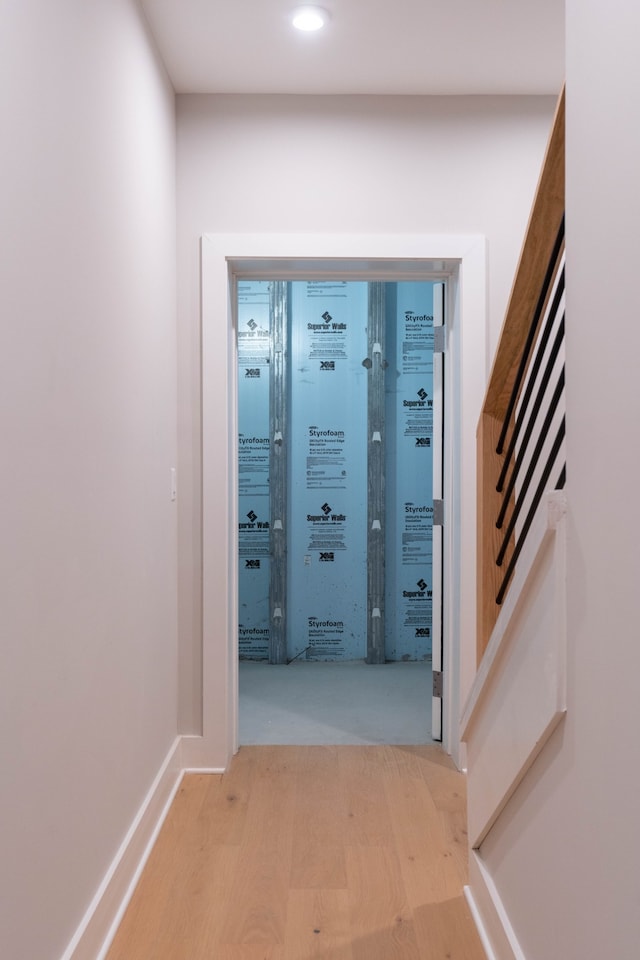 hall with light hardwood / wood-style floors