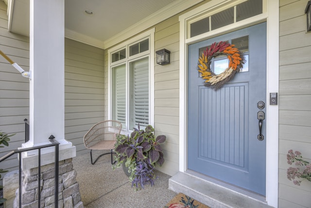 view of exterior entry featuring a porch