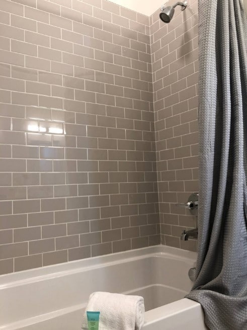 bathroom with shower / bathtub combination with curtain