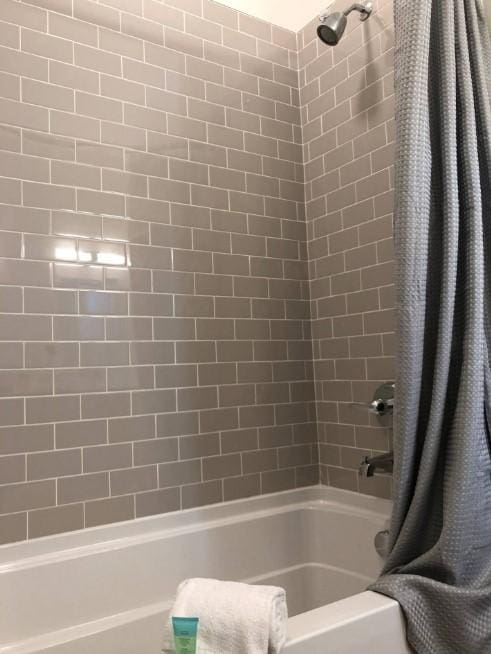 full bathroom with shower / tub combo