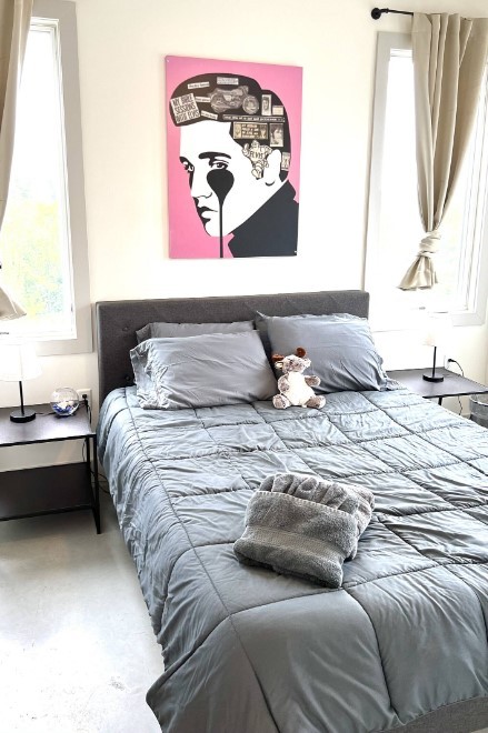 bedroom featuring concrete floors