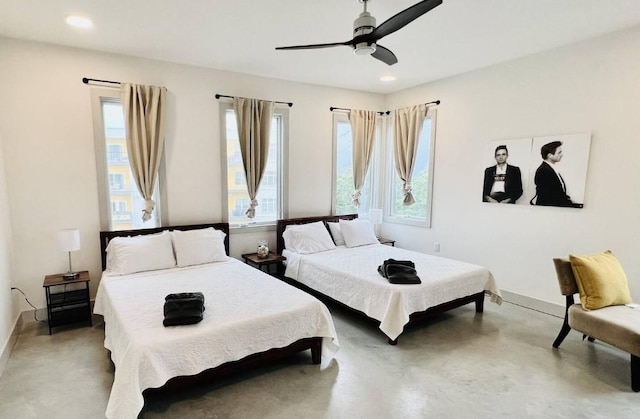 bedroom with a ceiling fan, concrete flooring, baseboards, and recessed lighting