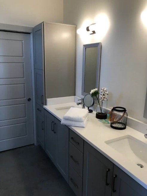 bathroom featuring vanity and concrete floors