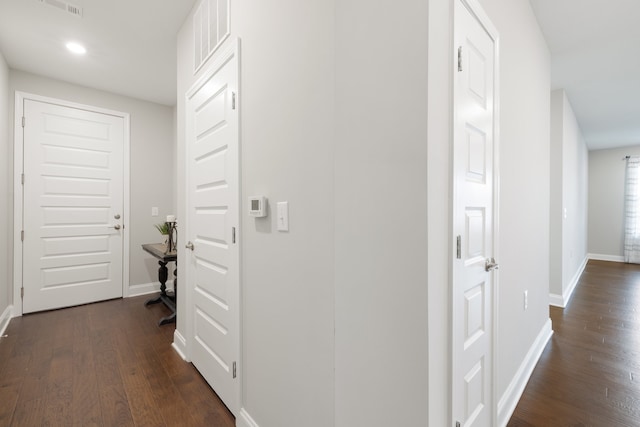 corridor featuring dark hardwood / wood-style floors