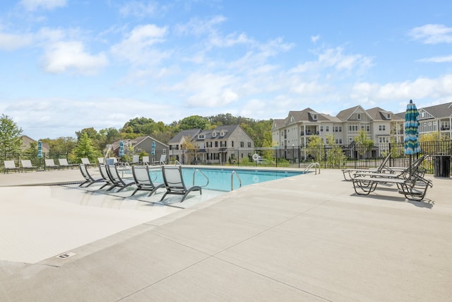 view of swimming pool with a patio area