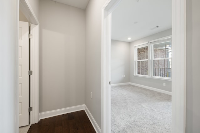 hallway featuring hardwood / wood-style flooring