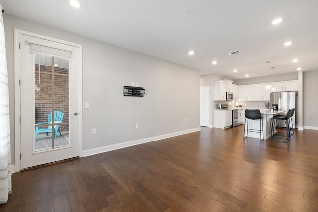 living room featuring dark wood-type flooring