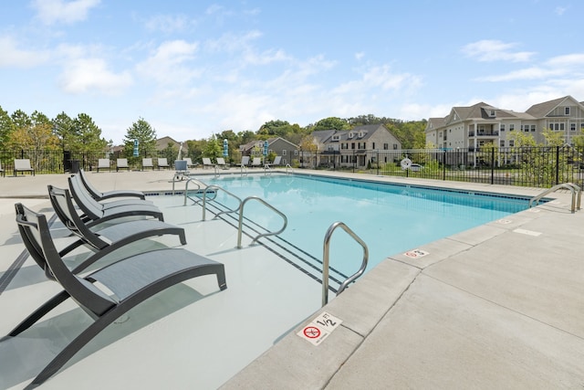 view of swimming pool with a patio