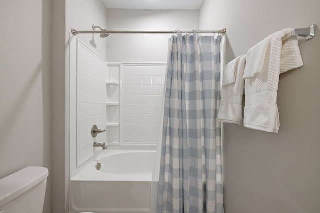 bathroom with toilet and shower / bathtub combination with curtain